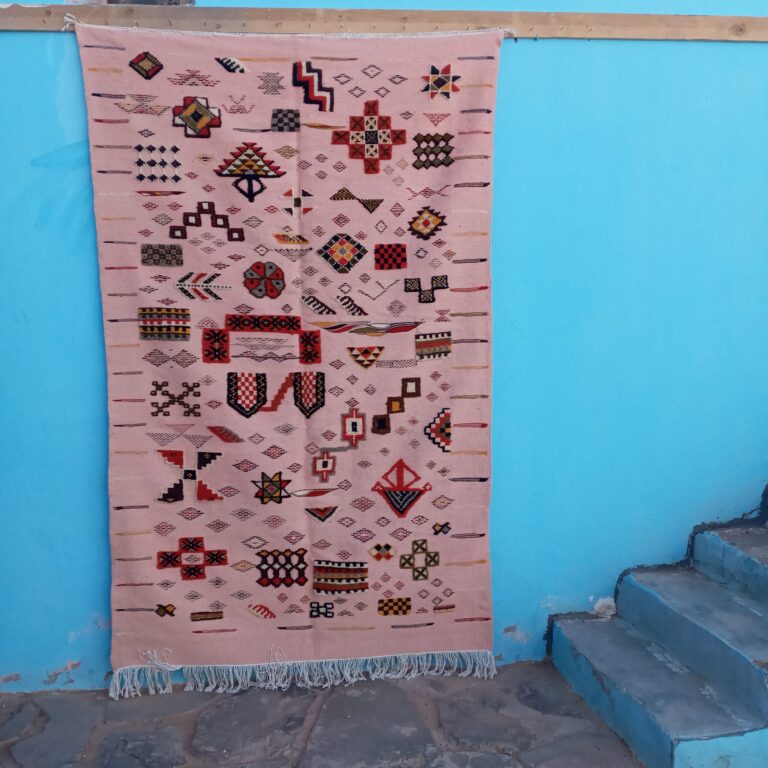Pink Moroccan carpet handmade from wool Berber pink rug with geometric patterns Moroccan pink wool rug on modern wood floor